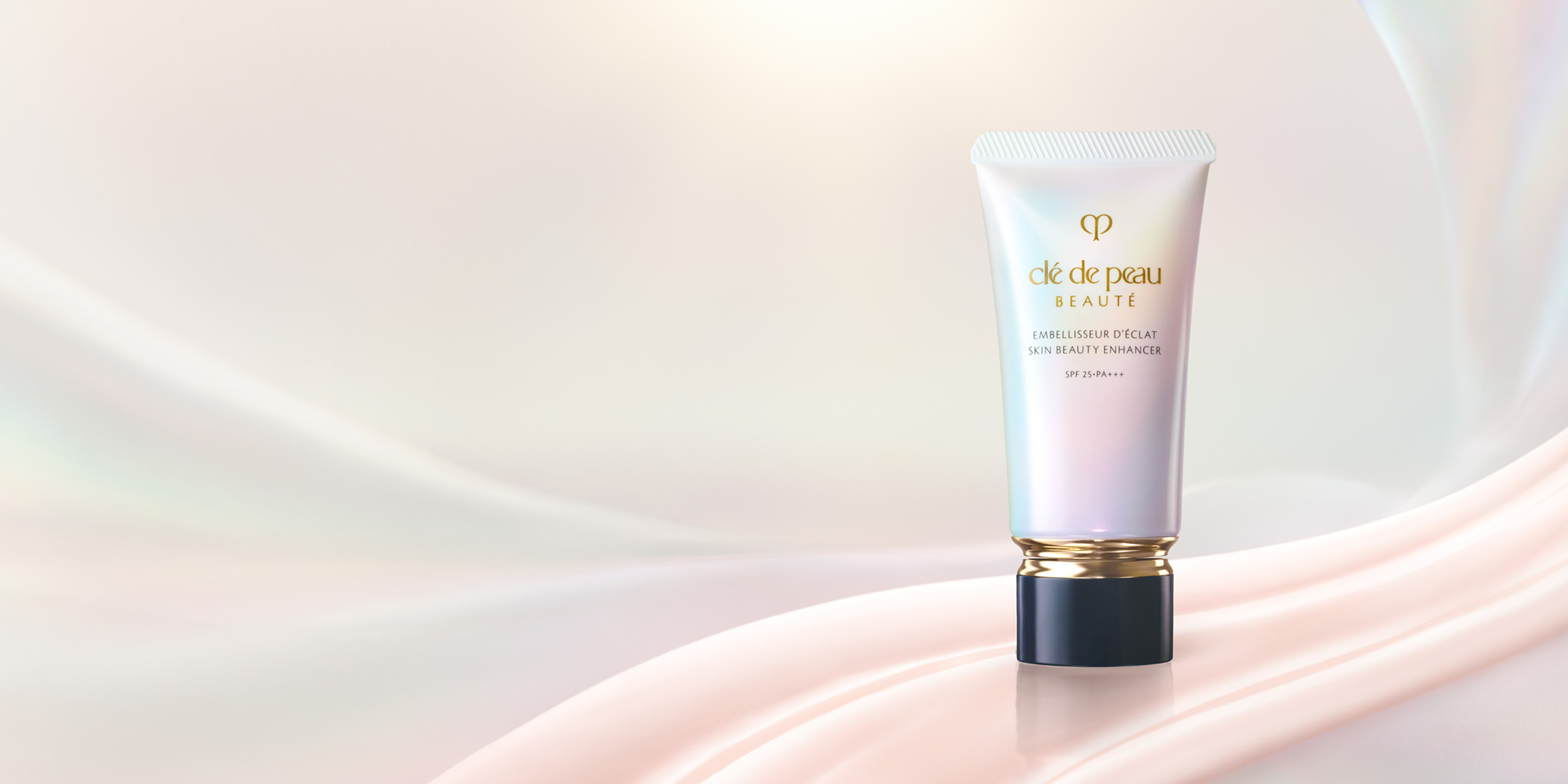 Photo of Brightening Serum Supreme bottle standing upright against a luminous background with golden rods and glowing spheres.