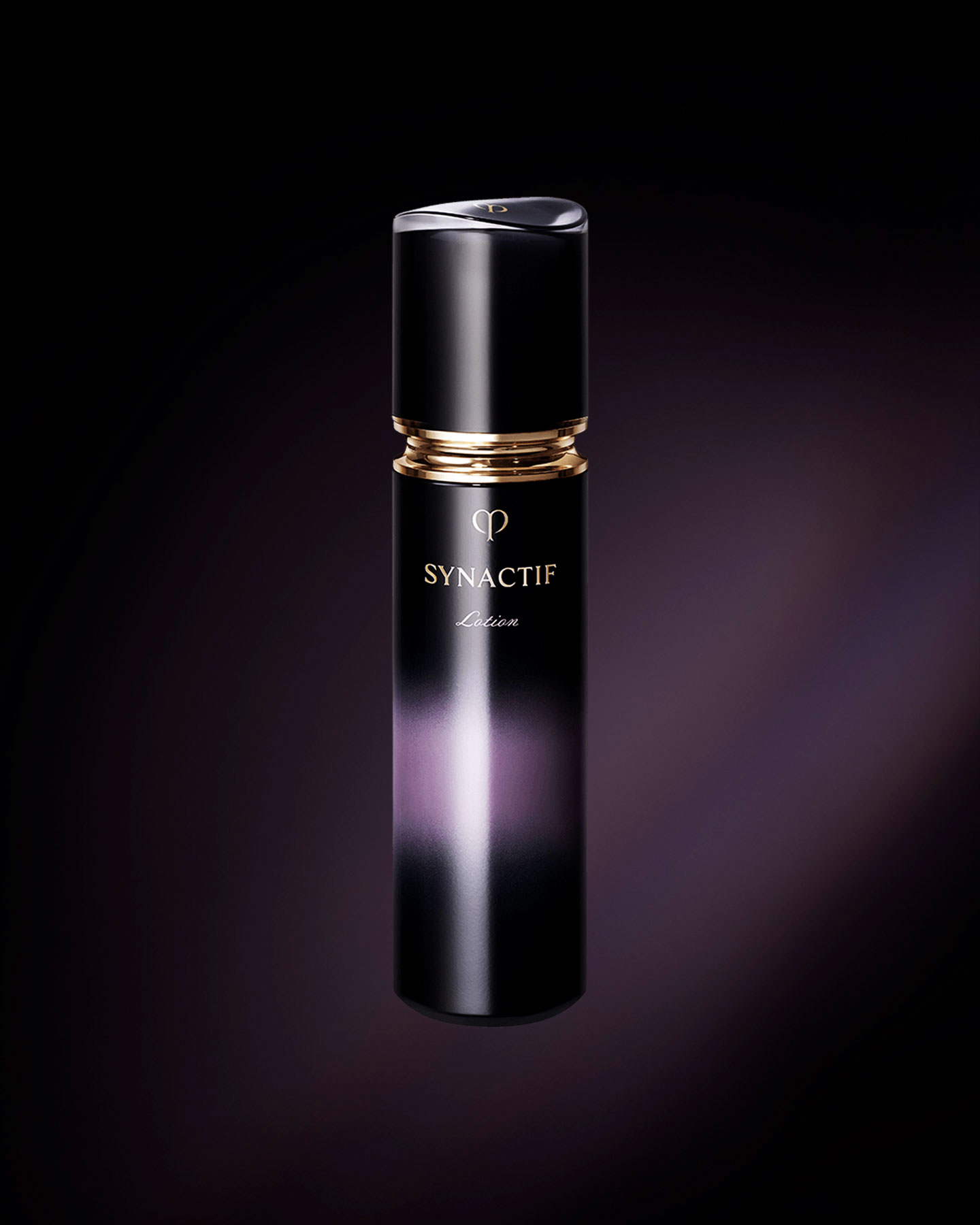 Photo of the sophisticated Cl&eacute; de Peau Beaut&eacute; SYNACTIF LOTION. The product is presented in a sleek, deep purple bottle that features a luminous gradient down the center, highlighted by a chic gold accent below the cap.
