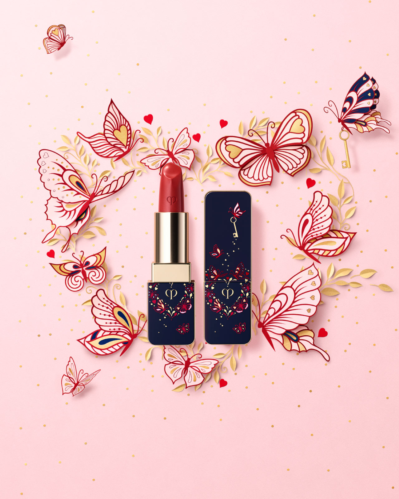 Photo of the limited-edition THE LIPSTICK 5 IN LIMITED-EDITION CASE. The blue-black case features a gold heart decorated with delicate pink butterfly motifs and a small gold key