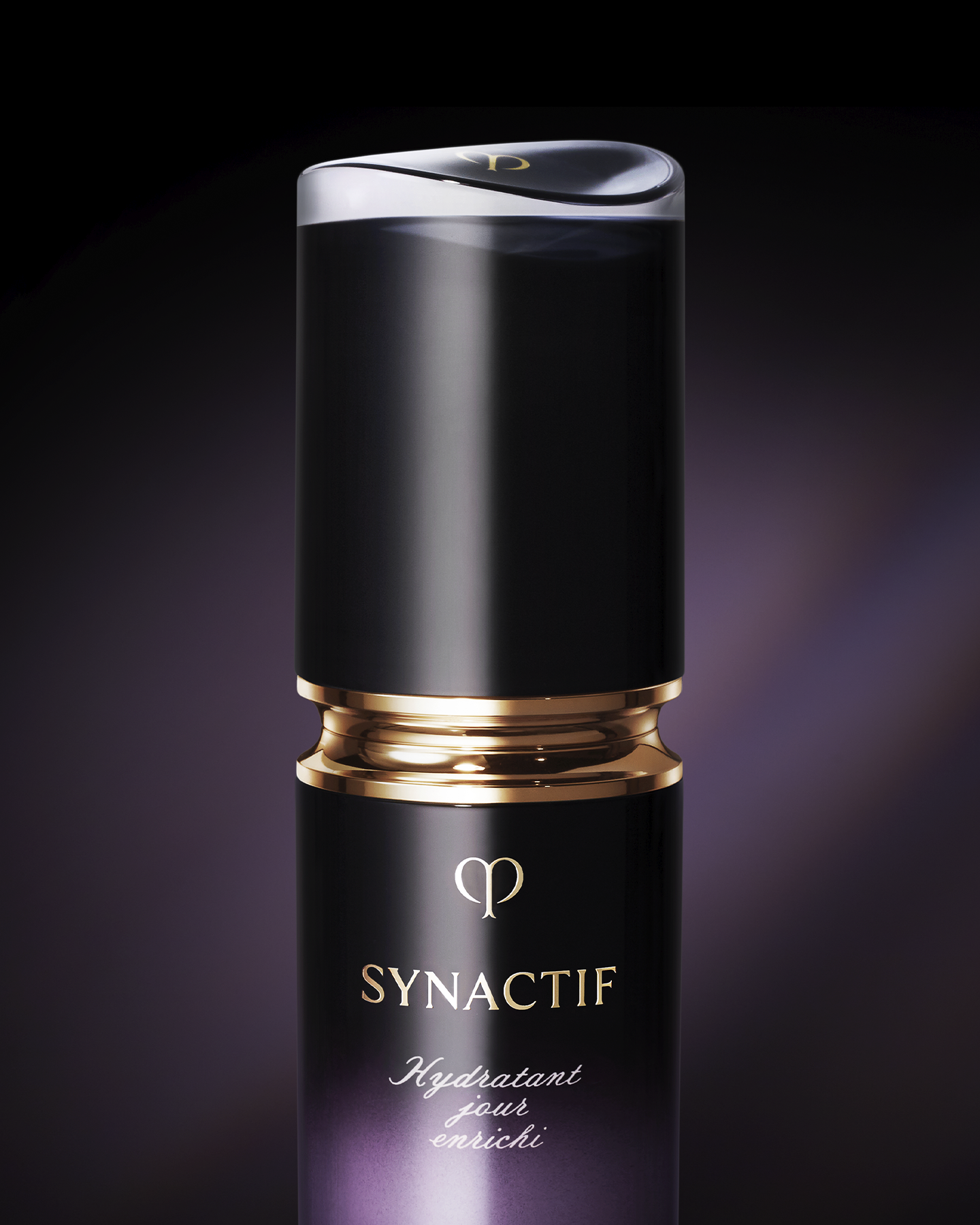 Photo of a close-up of the SYNACTIF NIGHTTIME MOISTURIZER bottle with a glossy gold ring and central gold brand logo, in an elegantly finished container.