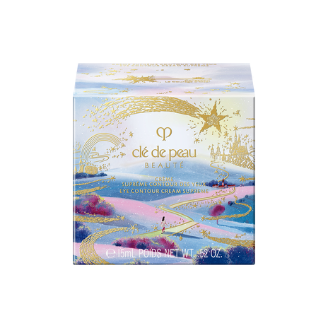 Photo of the 26 AW Holiday Collection limited-edition EYE CONTOUR CREAM SUPREME outer box. The square package features a scenic illustration of a path leading toward a castle under a starry sky, with a large gold shooting star across the top.