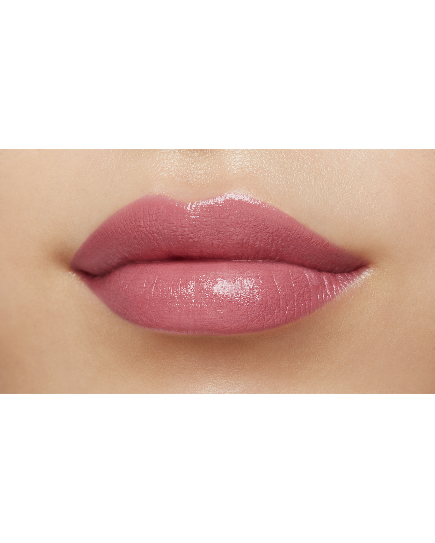 Photo of a medium skin tone model  wearing "LIPSTICK MATTE" in High Achieve on the lips.