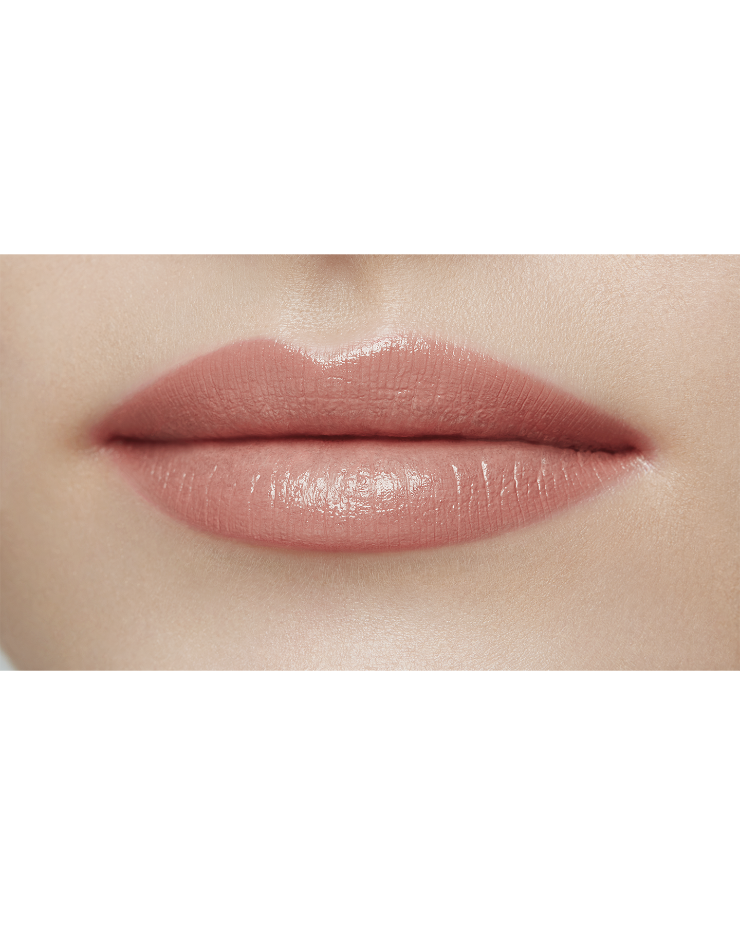 Photo of a light skin tone model  wearing "LIPSTICK MATTE" in Exuberant on the lips.