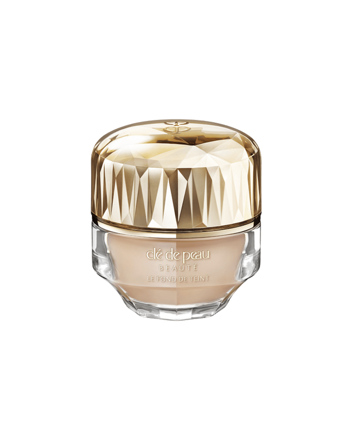 Photo of a jar of &ldquo;THE FOUNDATION,&rdquo; featuring an impressive multi-faceted gold cap and a substantial, luxurious glass bottle. SHADE: O20