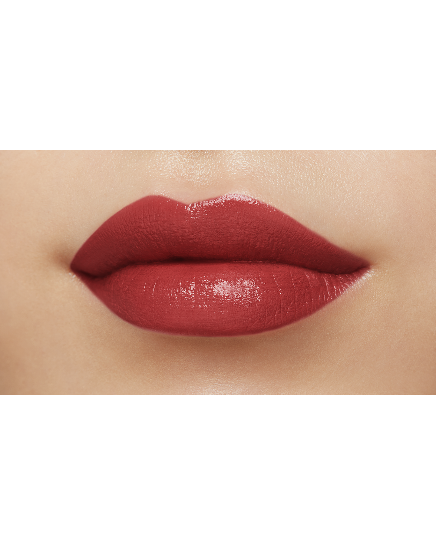 Photo of a medium skin tone model  wearing "LIPSTICK MATTE" in High Achieve on the lips.