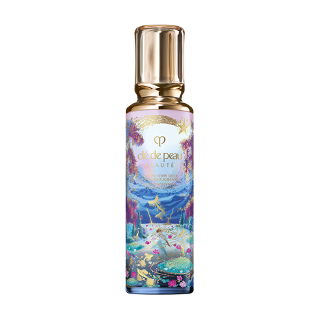 Photo of the 26 AW Holiday Collection limited-edition HYDRO-SOFTENING ESSENCE LOTION. The tall glass bottle features a scenic illustration of a lake with gold-colored fish and pink flowers, decorated with a gold shooting star and a clear gold cap.