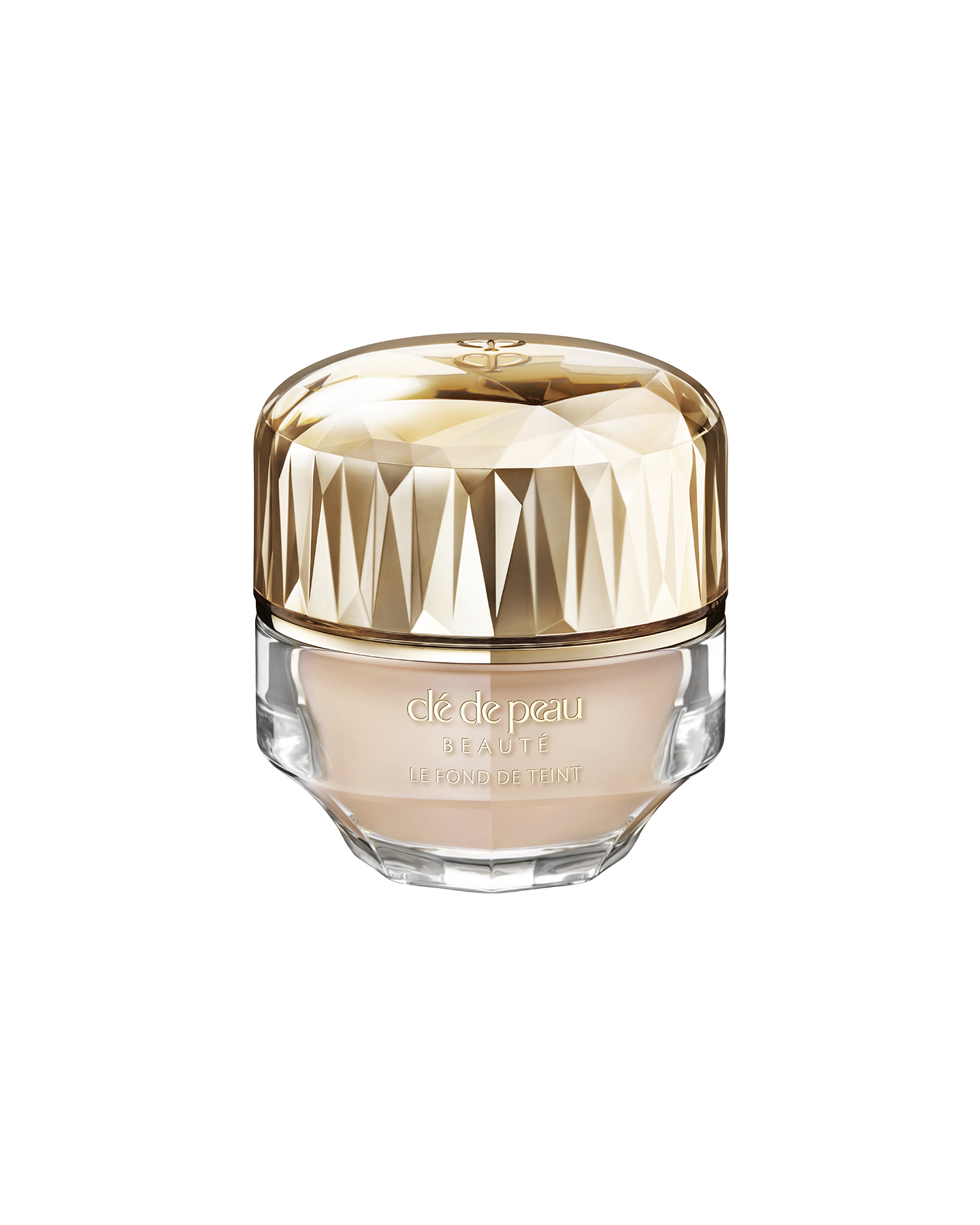 Photo of a jar of &ldquo;THE FOUNDATION,&rdquo; featuring an impressive multi-faceted gold cap and a substantial, luxurious glass bottle. SHADE: O10