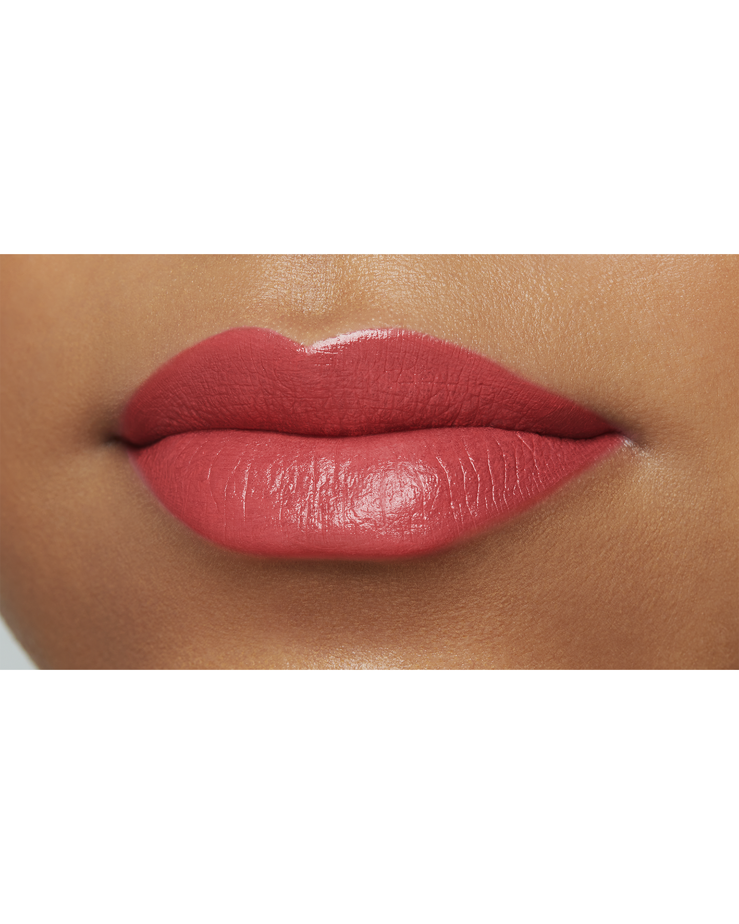 Photo of a deep skin tone model  wearing "LIPSTICK MATTE" in High Achieve on the lips.