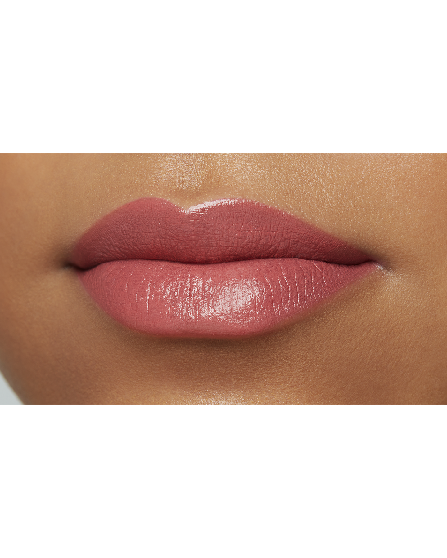 Photo of a deep skin tone model  wearing "LIPSTICK MATTE" in High Achieve on the lips.