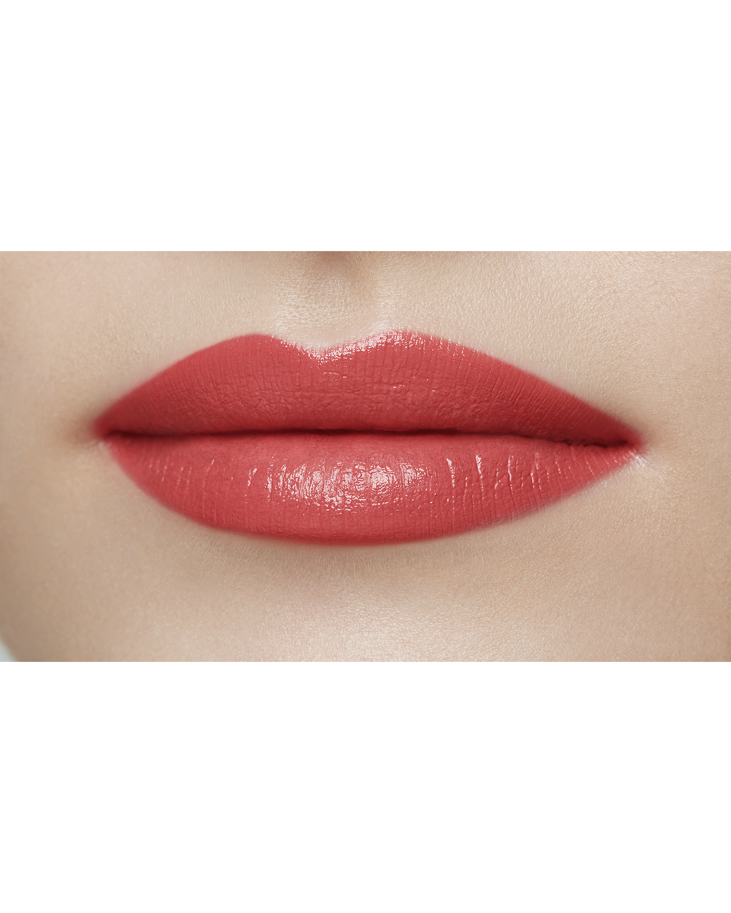 Photo of a light skin tone model  wearing "LIPSTICK MATTE" in High Achieve on the lips.