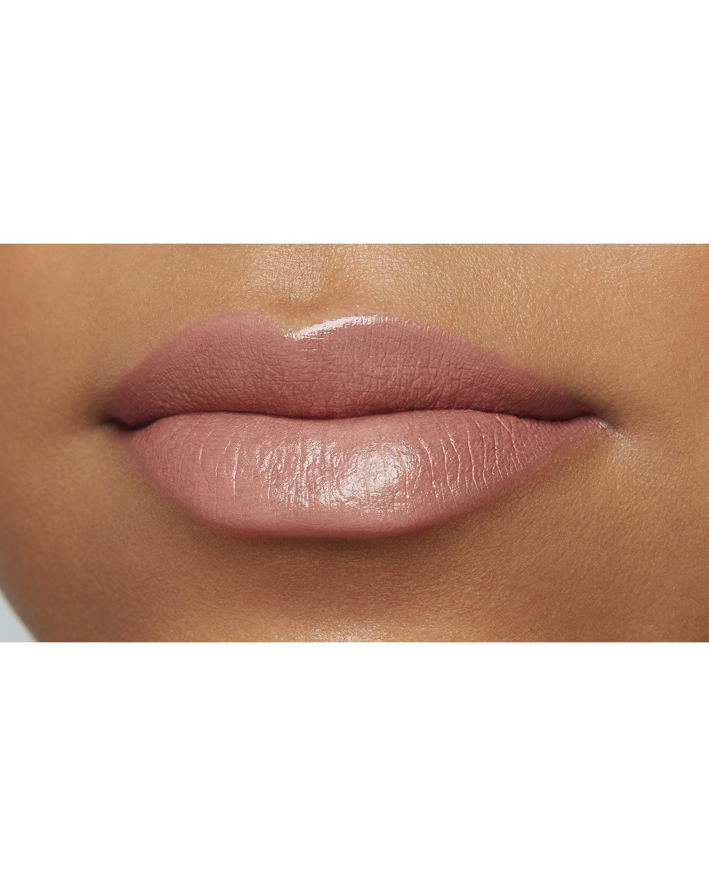 Photo of a deep skin tone model  wearing "LIPSTICK MATTE" in Exuberant on the lips.