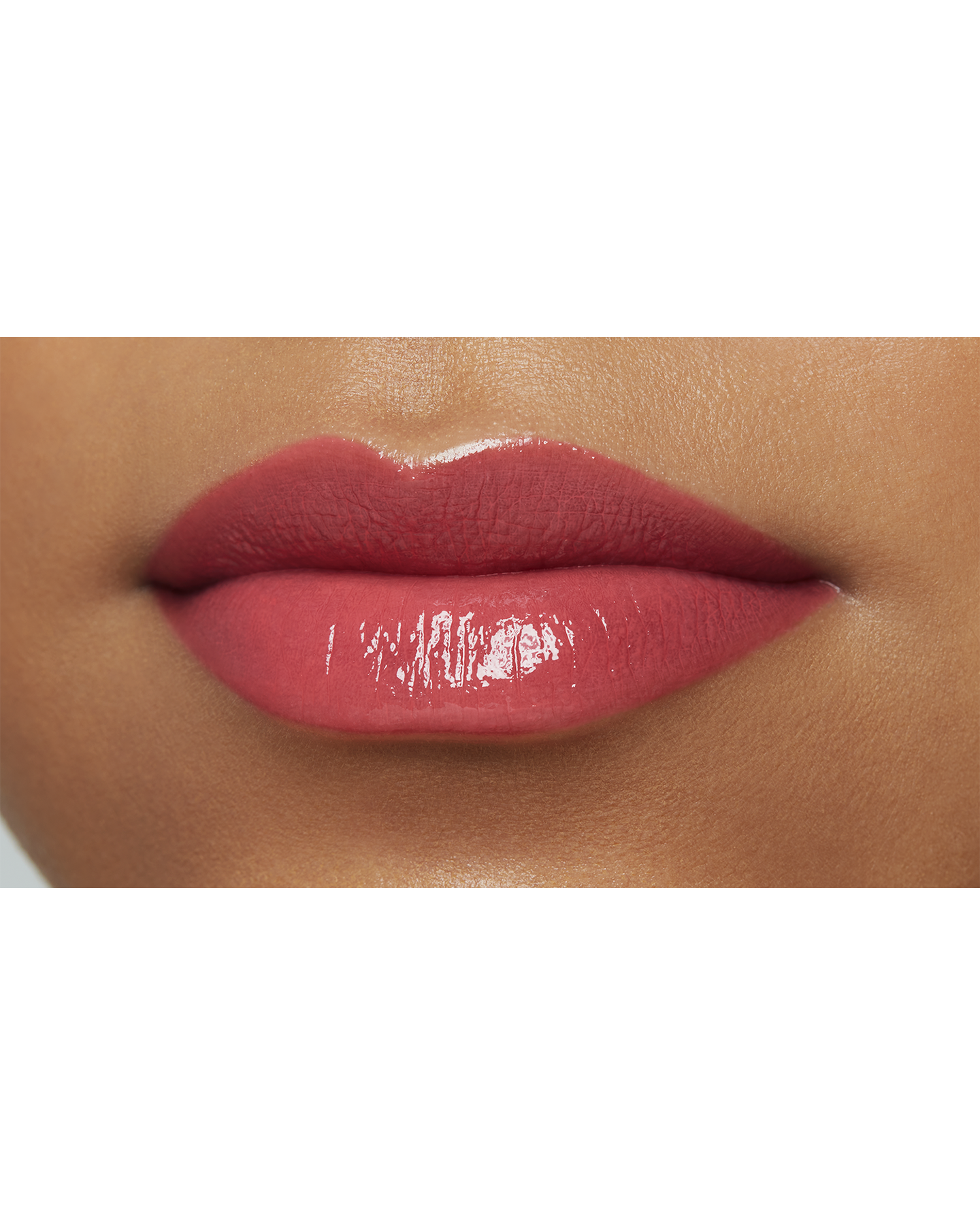Photo of a deep skin tone model  wearing  "LIPSTICK SHINE" in Always-Right Red on the lips.