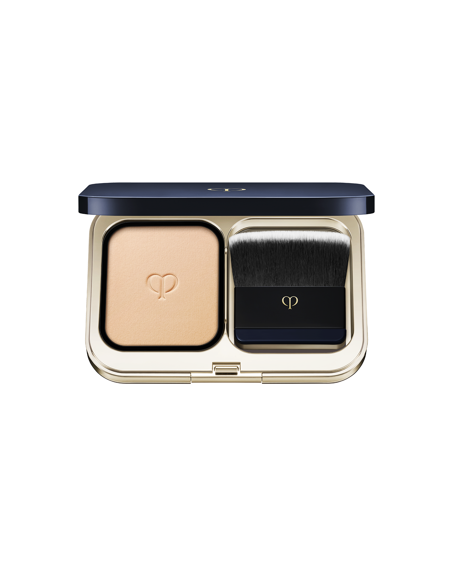 Photo of a gold compact case with powder foundation on the left and a brush on the right. SHADE: I10.