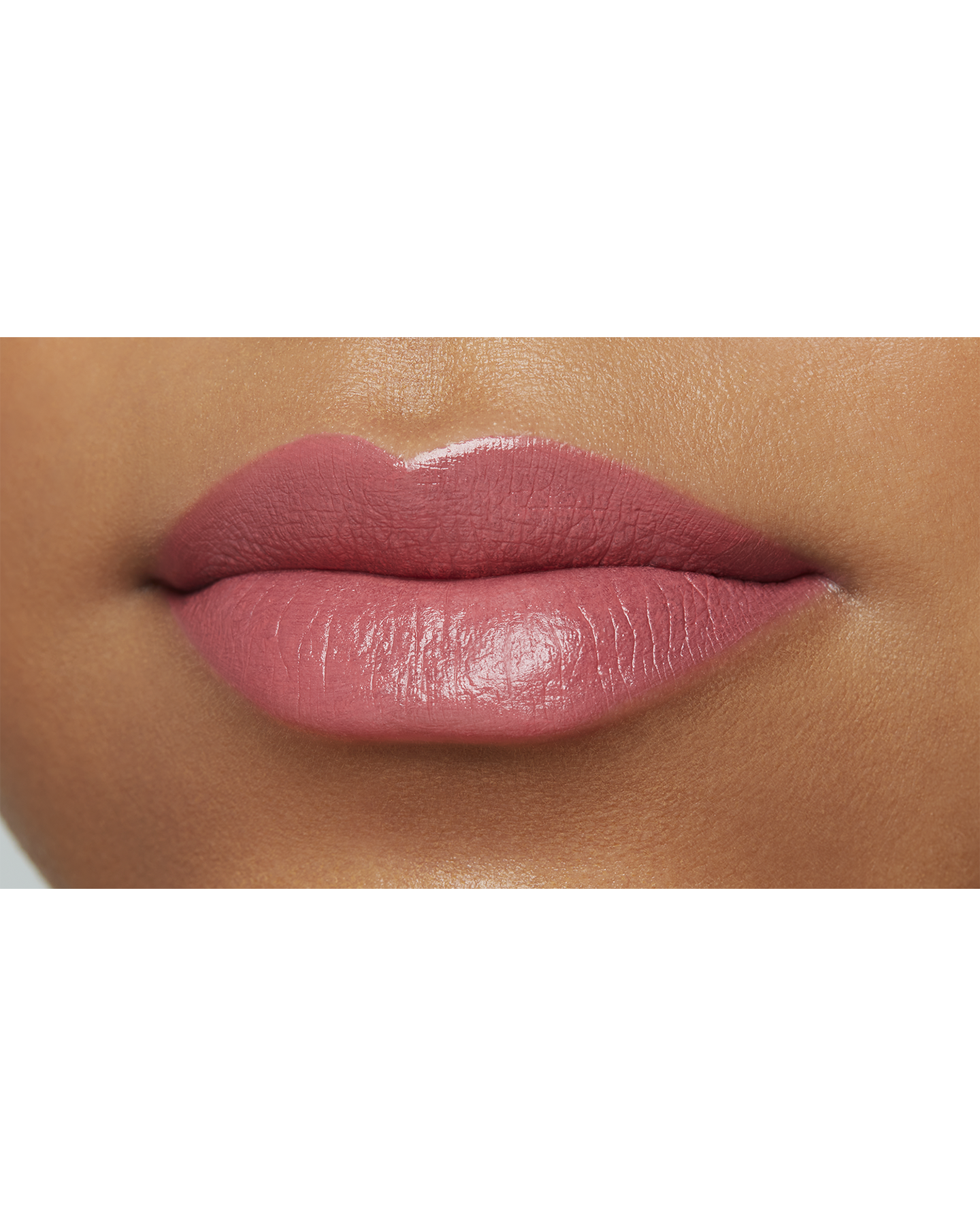 Photo of a deep skin tone model  wearing "LIPSTICK MATTE" in Agent Of Change on the lips.