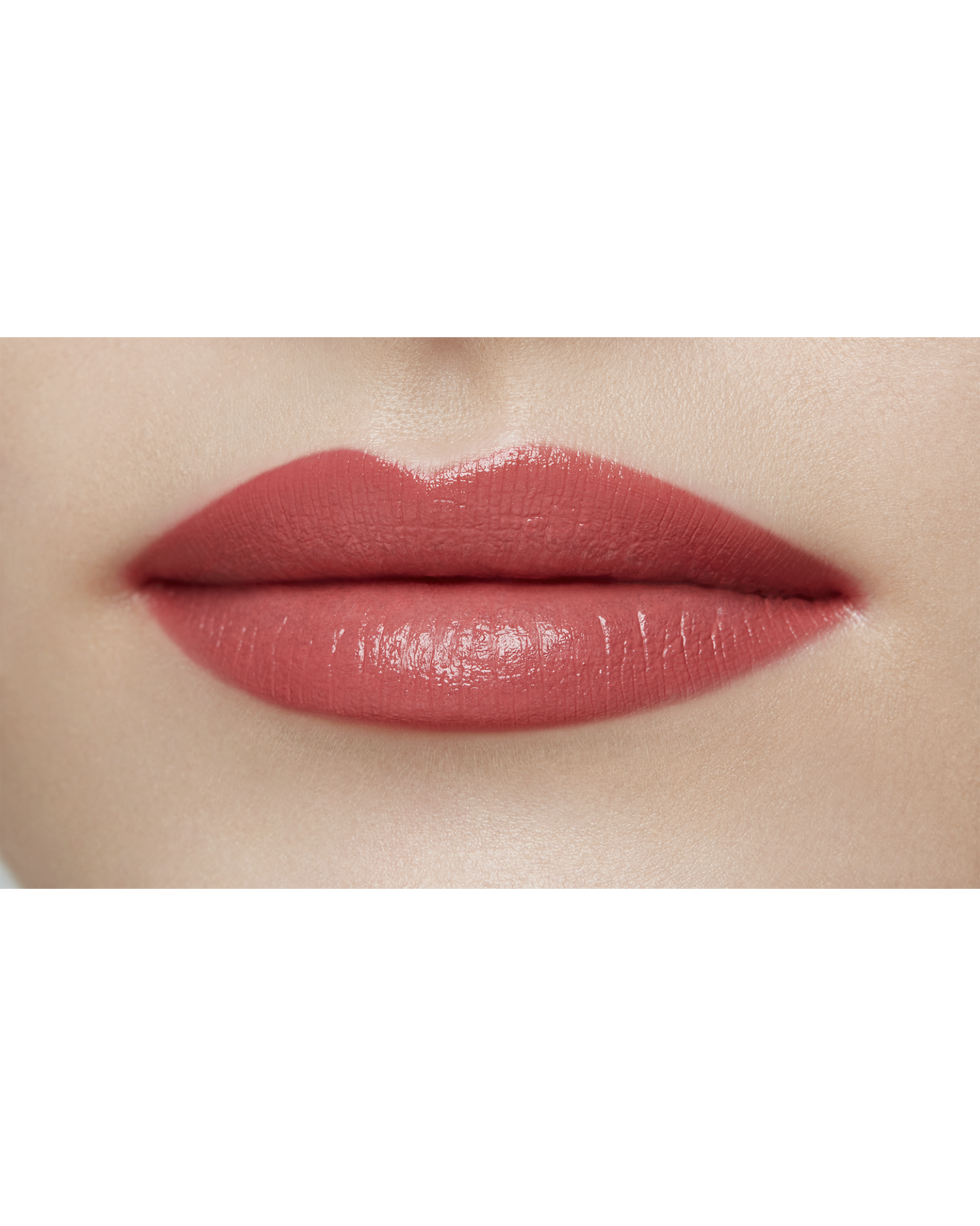 Photo of a light skin tone model  wearing "LIPSTICK MATTE" in High Achieve on the lips.