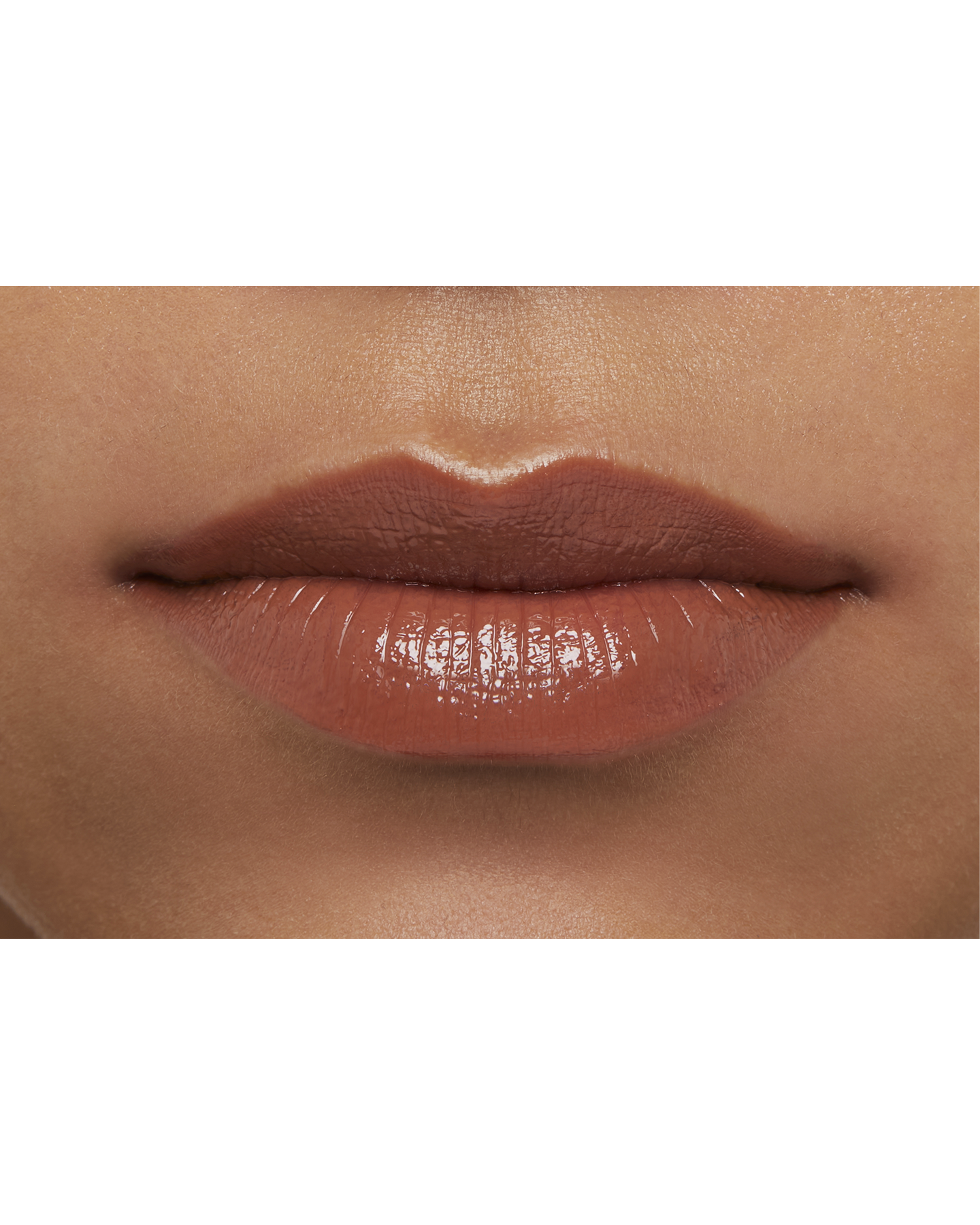Photo of a deep skin tone model  wearing  "LIPSTICK" in Amberkiss Pansy on the lips.