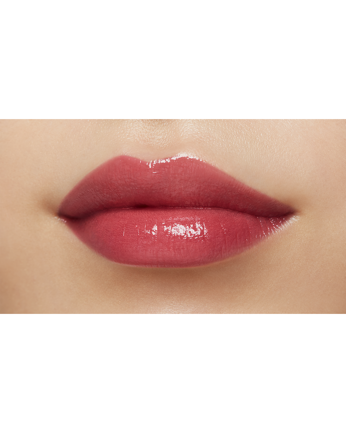 Photo of a medium skin tone model  wearing "LIPSTICK SHINE" in Always-Right Red on the lips.