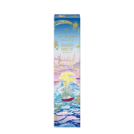 Photo of the 26 AW Holiday Collection limited-edition CORRECTING CREAM VEIL outer box. The package features an illustration of a red ship sailing in an icy sea under a full moon, decorated with a large gold shooting star at the top.