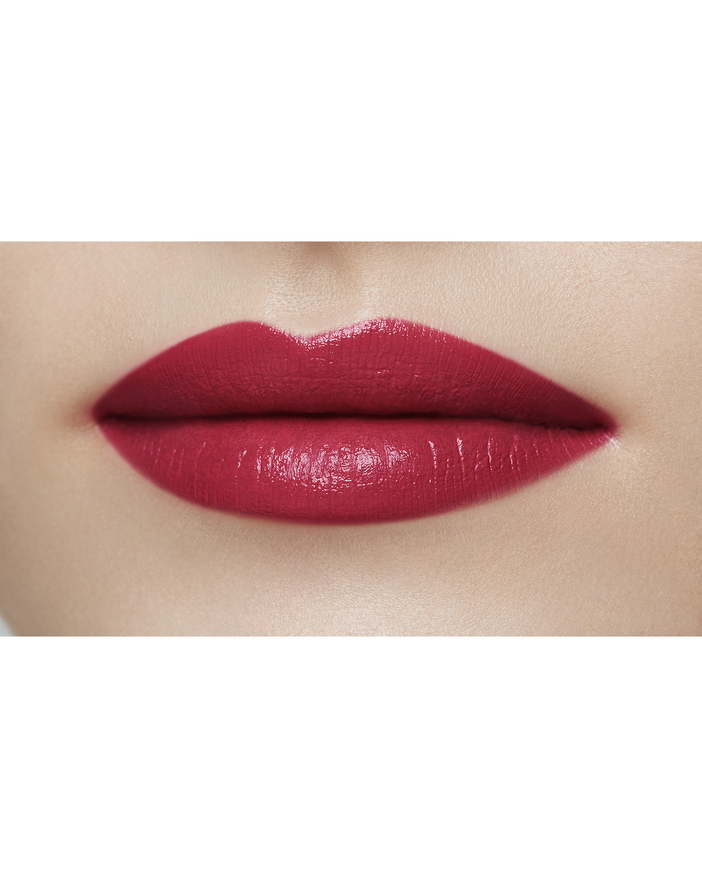 Photo of a light skin tone model  wearing "LIPSTICK MATTE" in High Achieve on the lips.