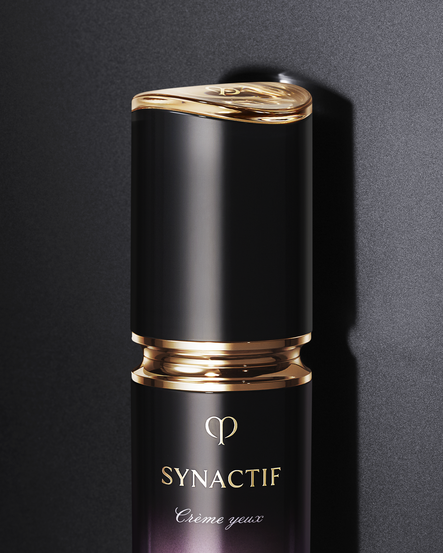 Photo of a close-up of the SYNACTIF EYE CREAM bottle with a glossy gold ring and central gold brand logo, in an elegantly finished container.