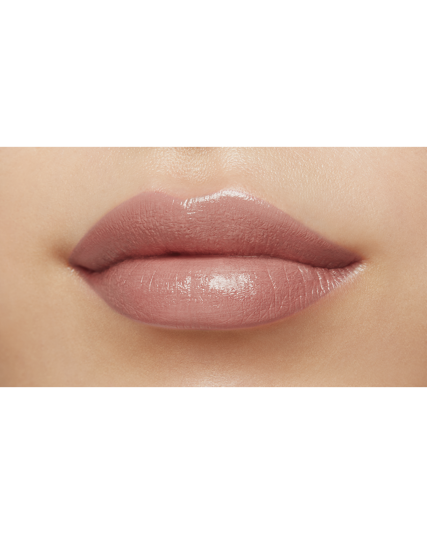 Photo of a medium skin tone model  wearing "LIPSTICK MATTE" in Exuberant on the lips.