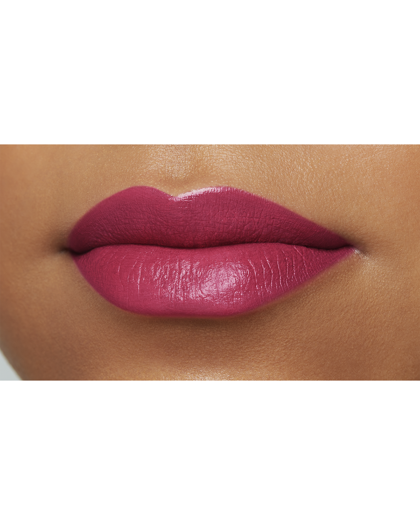 Photo of a deep skin tone model  wearing "LIPSTICK MATTE" in High Achieve on the lips.