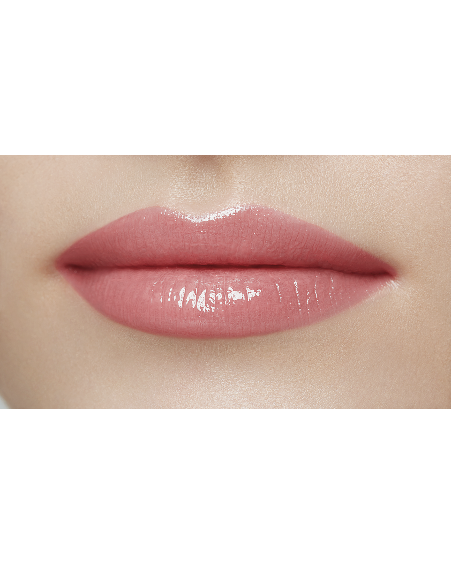 Photo of a light skin tone model  wearing  "LIPSTICK SHINE" in Influential on the lips.