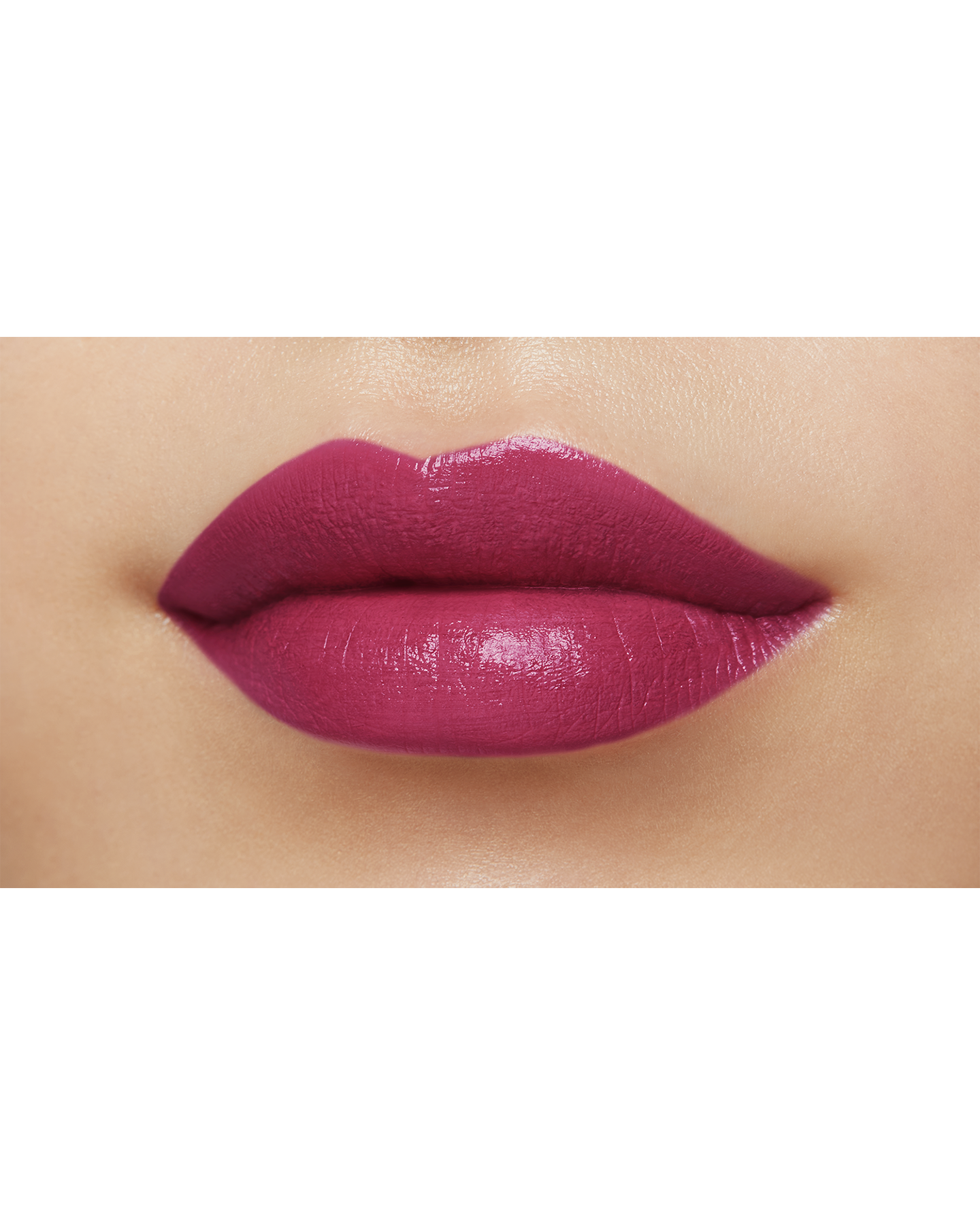 Photo of a medium skin tone model  wearing "LIPSTICK MATTE" in High Achieve on the lips.