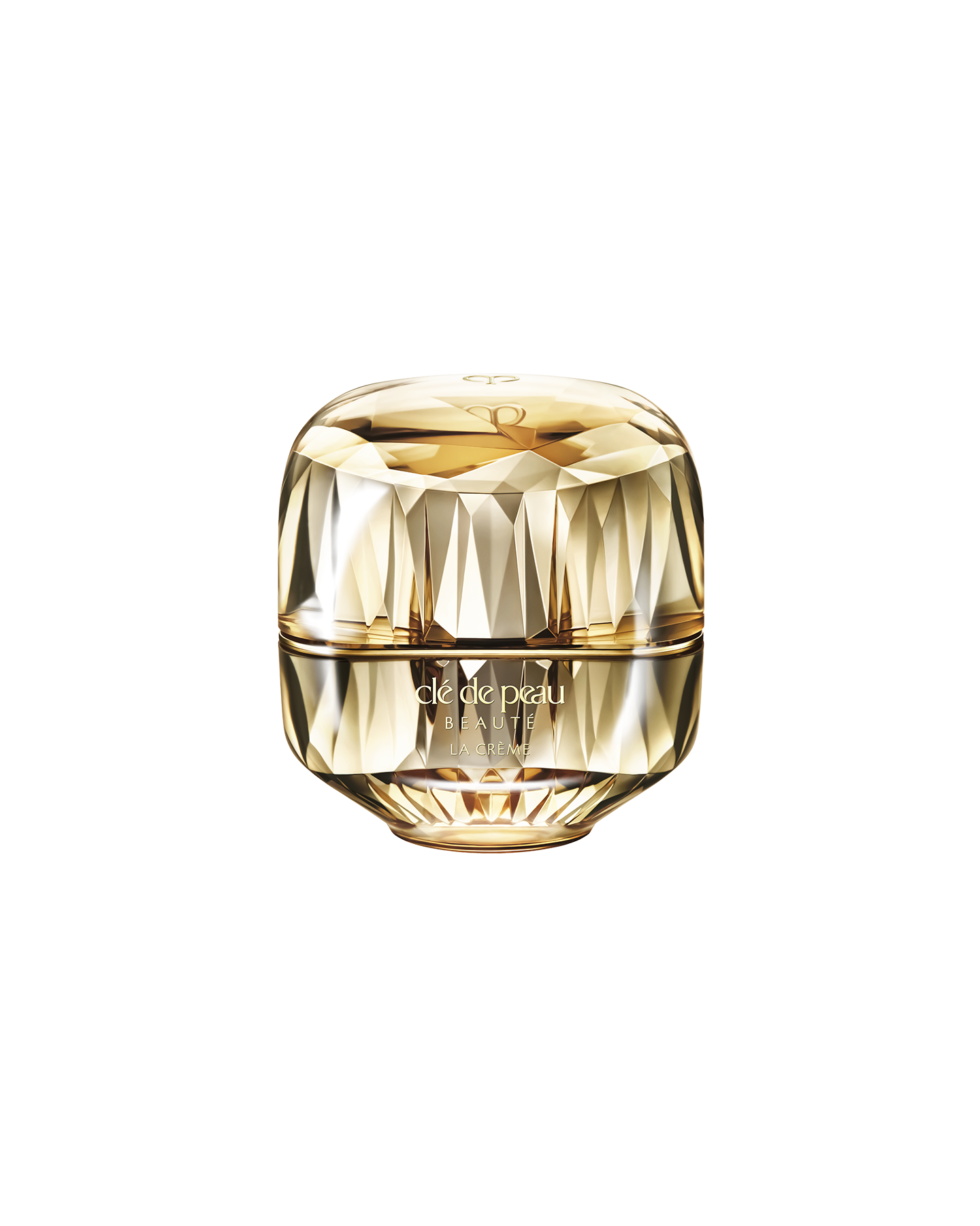 Photo of a jewel-cut, translucent gold container. The sparkling form reflects light, and the front features the brand logo and the text &ldquo;LA CR&Egrave;ME&rdquo;.