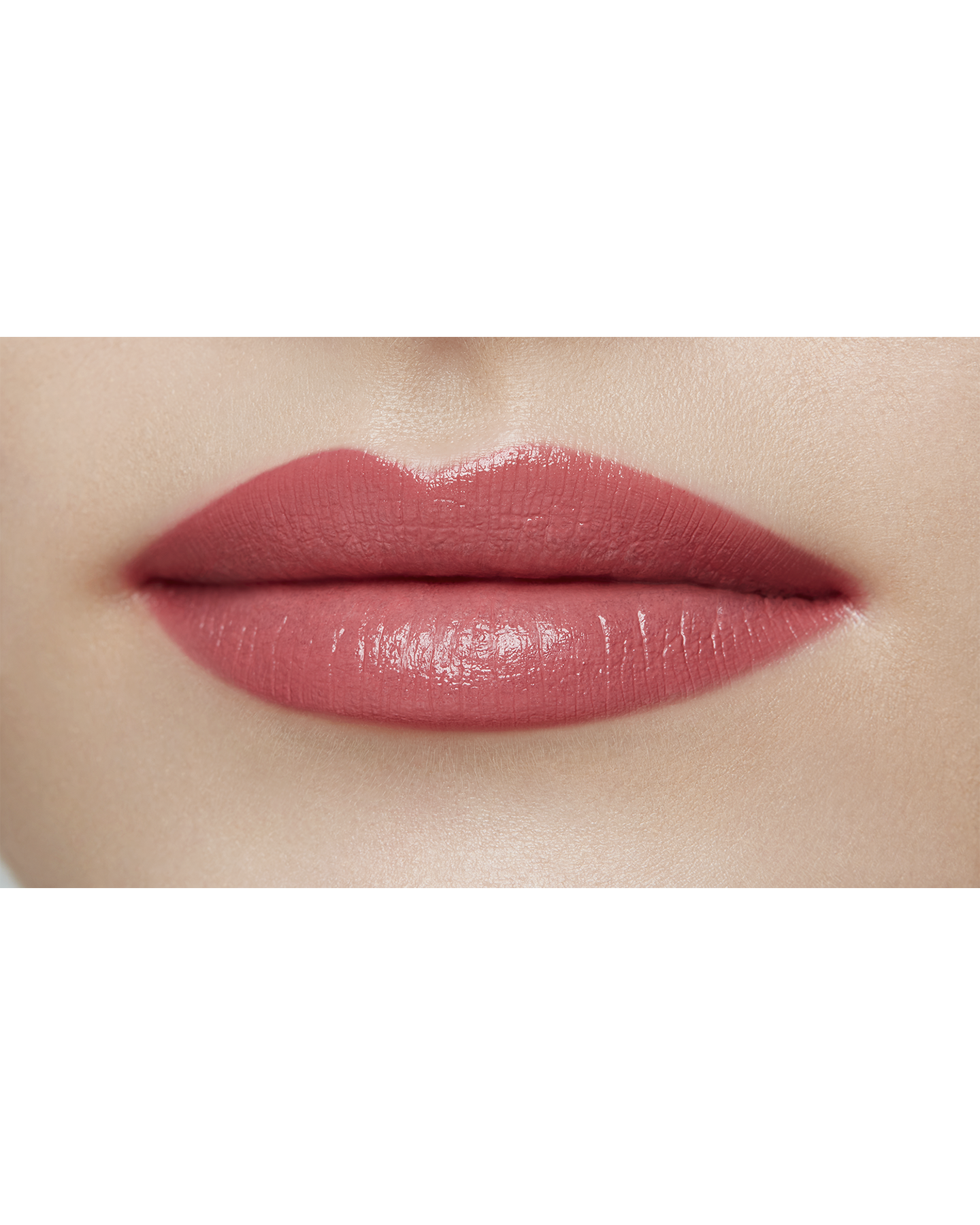 Photo of a light skin tone model  wearing "LIPSTICK MATTE" in Agent Of Change on the lips.