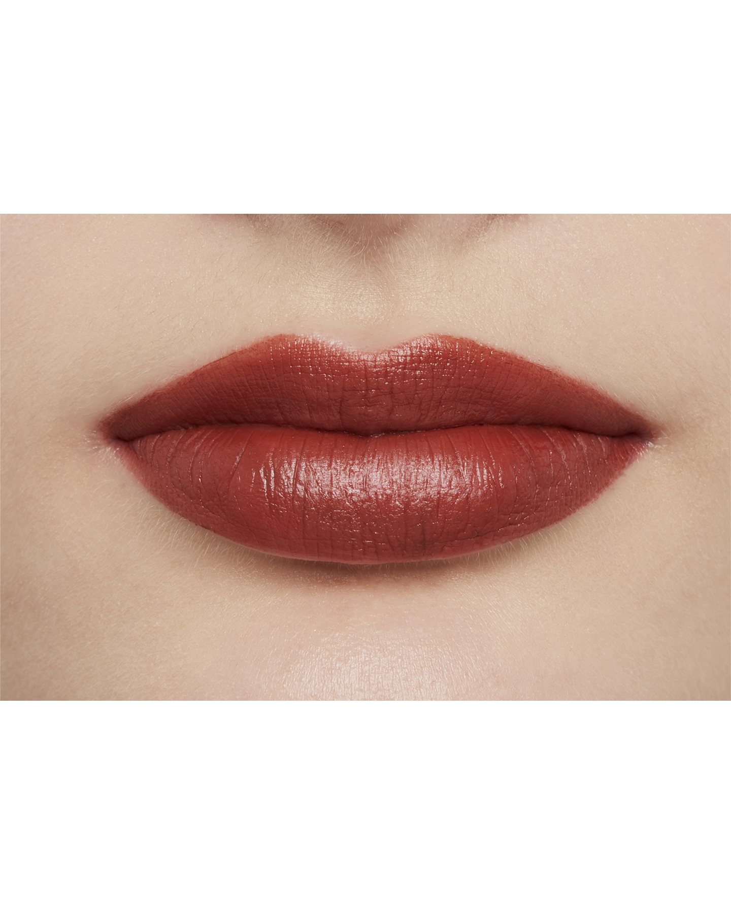 Photo of a light skin tone model  wearing "LIPSTICK MATTE" in High Achieve on the lips.