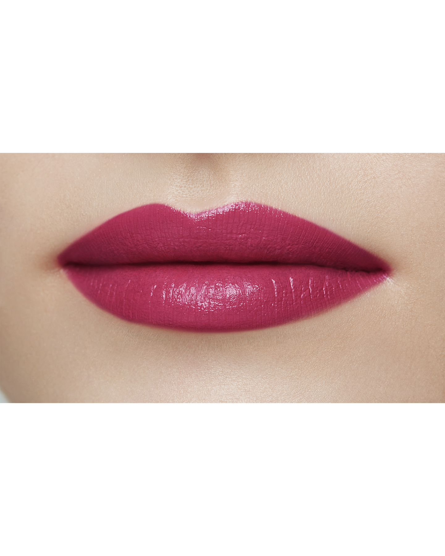 Photo of a light skin tone model  wearing "LIPSTICK MATTE" in High Achieve on the lips.