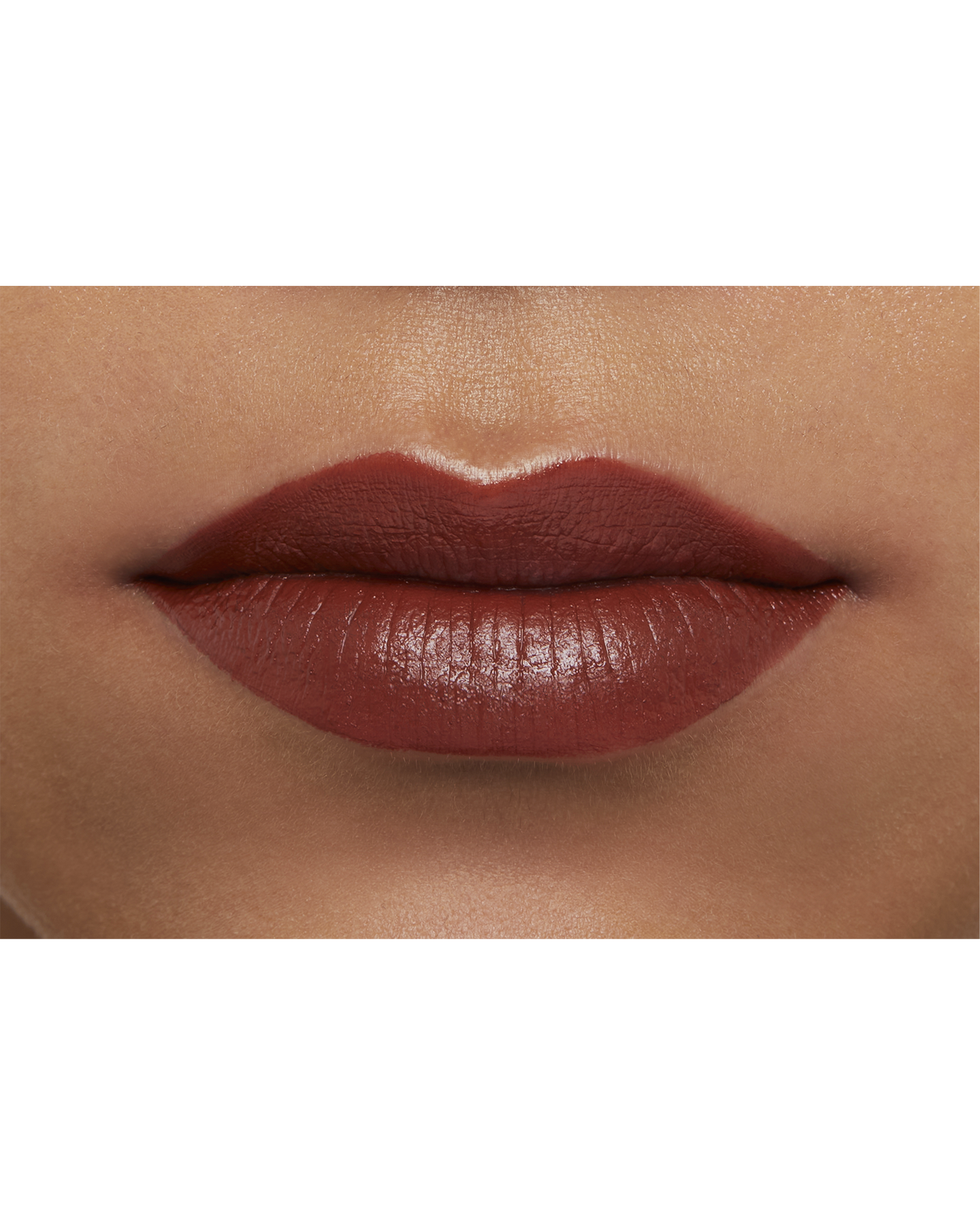 Photo of a deep skin tone model  wearing "LIPSTICK MATTE" in High Achieve on the lips.
