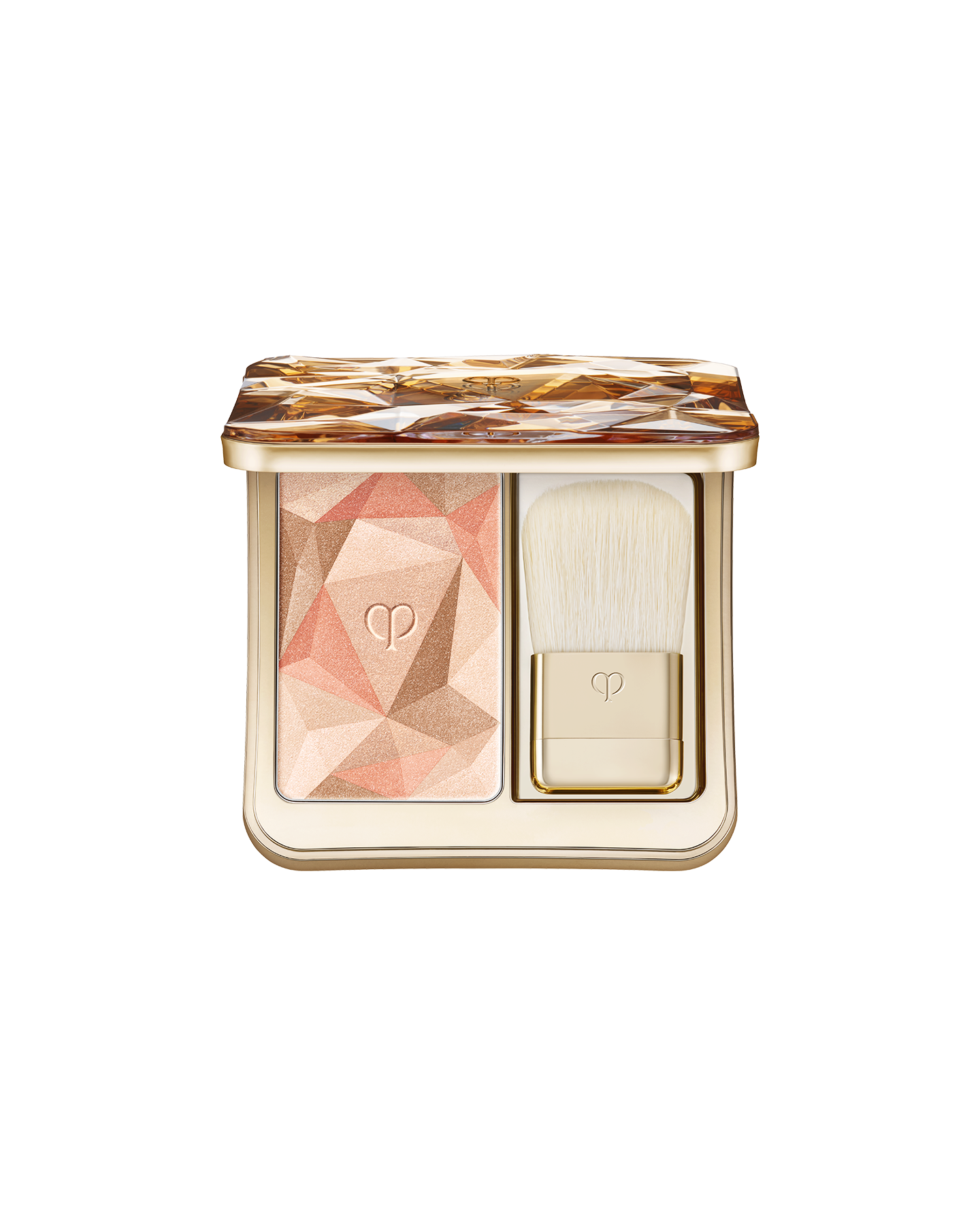 Photo of  &ldquo;THE LUMINIZING FACE ENHANCER,&rdquo; a face powder set that includes a highlighter powder designed with geometric patterns in peach, orange, and sand beige,  along with a gold brush. Shade: Shade: Shade: 203-Sunset&rsquo;s Brilliance.