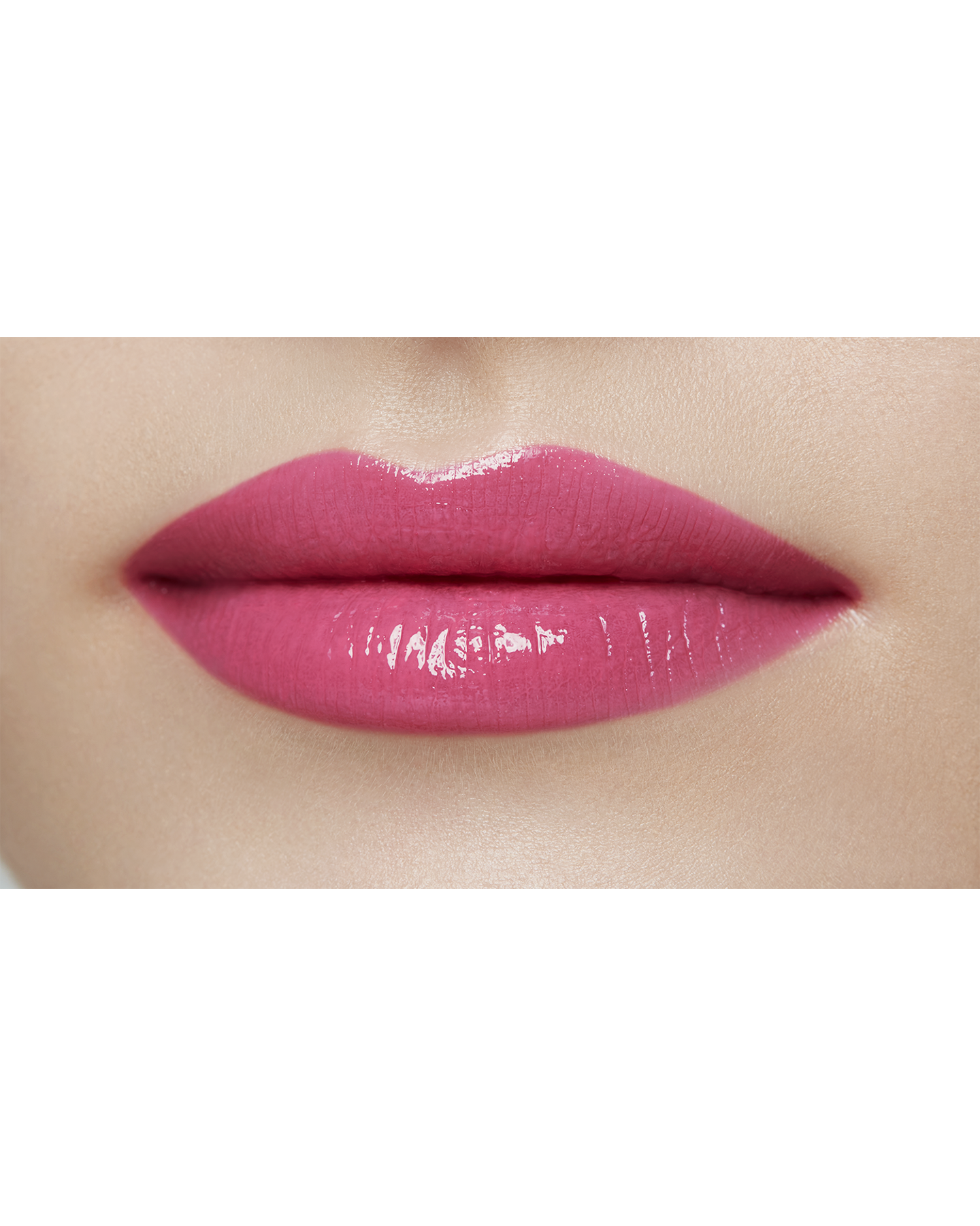 Photo of a light skin tone model  wearing  "LIPSTICK SHINE" in Go-Getter Grape on the lips.