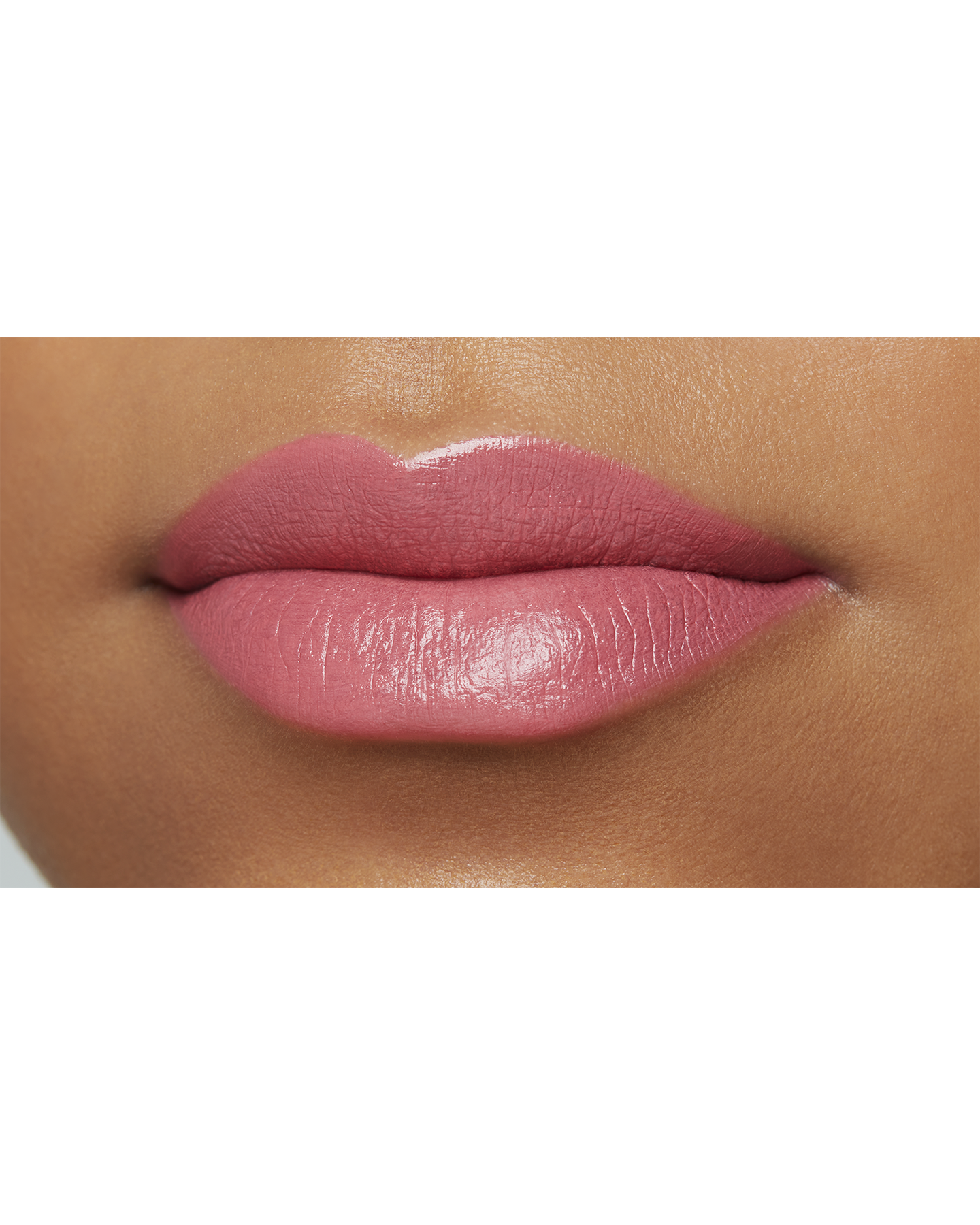 Photo of a deep skin tone model  wearing "LIPSTICK MATTE" in High Achieve on the lips.