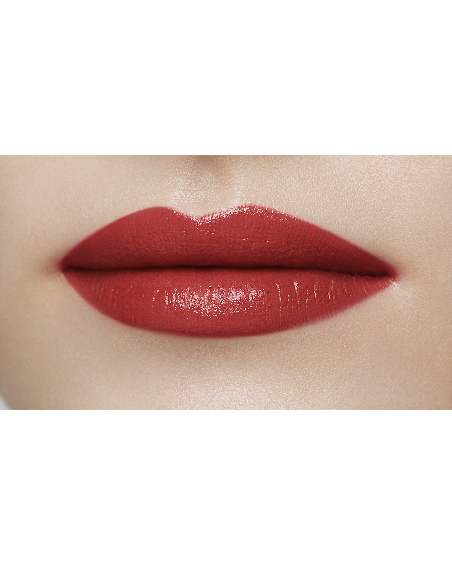 Photo of a light skin tone model  wearing "LIPSTICK MATTE" in High Achieve on the lips.