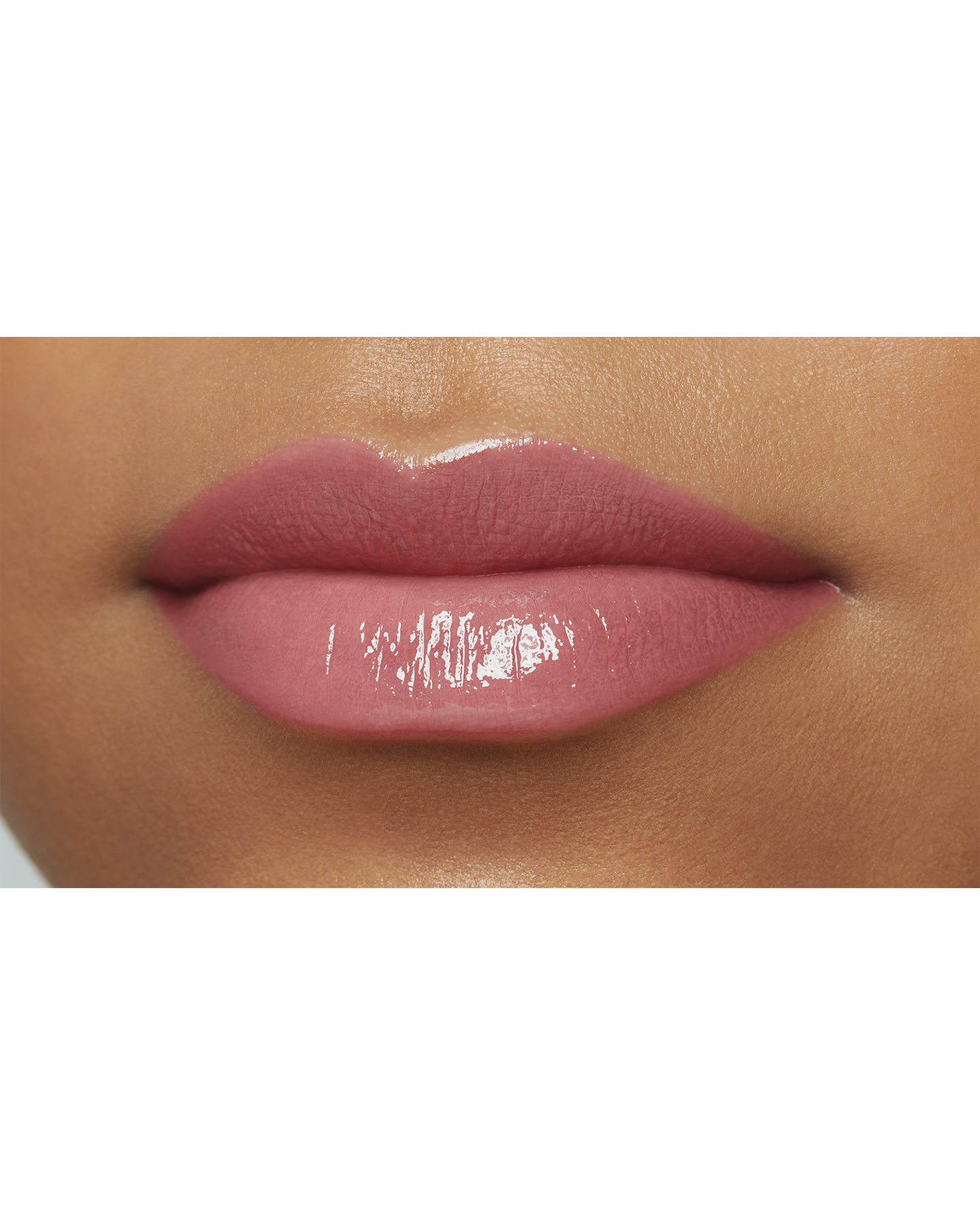 Photo of a deep skin tone model  wearing  "LIPSTICK SHINE" in Influential on the lips.